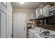 Neat laundry room area with shelves and a white washer and dryer set at 2006 W Summit Pl, Chandler, AZ 85224