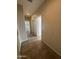 A hallway features tiled flooring and leads to other areas of the home at 2010 E Indigo Dr, Chandler, AZ 85286