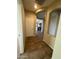 Hallway showcasing an arched doorway, tile floors, and a clear view into the kitchen area at 2010 E Indigo Dr, Chandler, AZ 85286