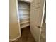 A well-organized pantry with multiple shelves offers ample storage space in this home at 2010 E Indigo Dr, Chandler, AZ 85286