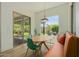 Bright dining area with a modern table, seating, and slider doors to the backyard patio at 2011 W Calle De Las Estrella --, Phoenix, AZ 85085