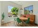 Cozy dining area with a banquette, modern chairs, and views of the backyard oasis at 2011 W Calle De Las Estrella --, Phoenix, AZ 85085