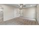 Bedroom featuring carpet, neutral walls, ceiling fan, two closets and access to bathroom at 20210 N 124Th Dr, Sun City West, AZ 85375