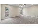 Bright bedroom featuring neutral walls, carpet and two large windows allowing natural light at 20210 N 124Th Dr, Sun City West, AZ 85375