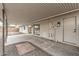 Covered patio with a door to the backyard and sliding glass doors to the main house at 20210 N 124Th Dr, Sun City West, AZ 85375