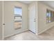 Bright foyer with tile flooring, featuring natural light from the window and a view to the front door at 20210 N 124Th Dr, Sun City West, AZ 85375