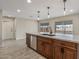 Kitchen island with stainless steel appliances, quartz countertops, and pendant lighting at 20210 N 124Th Dr, Sun City West, AZ 85375