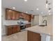 Close up of a kitchen with stainless appliances, ample cabinets, and a central island at 20210 N 124Th Dr, Sun City West, AZ 85375