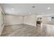 Open living room featuring neutral walls, tile floors, recessed lighting, and a seamless flow into the kitchen at 20210 N 124Th Dr, Sun City West, AZ 85375