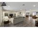 Inviting open-concept living room and dining area featuring neutral tones and updated flooring at 20210 N 124Th Dr, Sun City West, AZ 85375