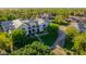 Aerial view of stunning home featuring lush landscaping, mature trees, and large private driveway at 20406 E Sunset Ct, Queen Creek, AZ 85142