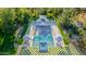 Aerial view of a private pool, spa, lounge chairs, and umbrellas surrounded by lush greenery at 20406 E Sunset Ct, Queen Creek, AZ 85142