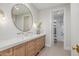 Modern bathroom with double sink vanity and an open shower at 20406 E Sunset Ct, Queen Creek, AZ 85142