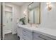 Gorgeous bathroom featuring a large mirror, a walk in shower, and a decorative plant at 20406 E Sunset Ct, Queen Creek, AZ 85142