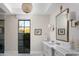 A stylish bathroom vanity with a decorative mirror at 20406 E Sunset Ct, Queen Creek, AZ 85142