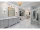 A bright bathroom offers dual vanities, a soaking tub, and a glass-enclosed shower at 20406 E Sunset Ct, Queen Creek, AZ 85142