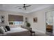 Calm bedroom featuring a tray ceiling, an ensuite bathroom, and a soothing color palette at 20406 E Sunset Ct, Queen Creek, AZ 85142