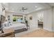 Neutral bedroom with a decorative light fixture, and an ensuite bathroom at 20406 E Sunset Ct, Queen Creek, AZ 85142