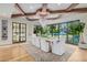 Bright dining area showcasing hardwood floors, bright natural lighting, and an elegant chandelier at 20406 E Sunset Ct, Queen Creek, AZ 85142