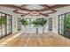 Dining room with hardwood floors, elegant chandelier and views of the outdoor pool at 20406 E Sunset Ct, Queen Creek, AZ 85142