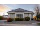 Exterior view showcasing decorative landscaping, a stone driveway, and architecture with warm sunset ambiance at 20406 E Sunset Ct, Queen Creek, AZ 85142