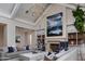 Bright living room exhibiting hardwood floors, built-in shelving, fireplace and neutral furniture at 20406 E Sunset Ct, Queen Creek, AZ 85142