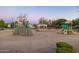 Community playground with climbing wall, slide, and covered picnic tables at 20406 E Sunset Ct, Queen Creek, AZ 85142