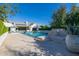 Expansive pool area showcasing its stepped design, water features, and landscaped surroundings at 20406 E Sunset Ct, Queen Creek, AZ 85142