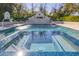 Close-up of a luxurious pool with a captivating mosaic-tiled spa and elegant water features at 20406 E Sunset Ct, Queen Creek, AZ 85142