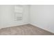 Bedroom showcasing neutral walls, carpet, and a window with blinds at 20660 N Confetti Ct, Maricopa, AZ 85138