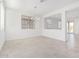 A dining room featuring tile flooring, bright natural light, and a modern chandelier at 20660 N Confetti Ct, Maricopa, AZ 85138