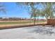 Spacious backyard features desert landscaping and a view of the neighborhood at 22139 N Van Loo Dr, Maricopa, AZ 85138