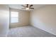 Bedroom featuring plush carpeting, ceiling fan, and window with blinds at 22139 N Van Loo Dr, Maricopa, AZ 85138