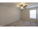 Bedroom with ceiling fan, carpet flooring, and a window providing natural light at 22139 N Van Loo Dr, Maricopa, AZ 85138