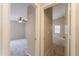 Neutral-toned hallway view of bedrooms with carpet at 22139 N Van Loo Dr, Maricopa, AZ 85138