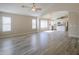 Open living room flows into the kitchen with island and white cabinets, creating an inviting living space at 22139 N Van Loo Dr, Maricopa, AZ 85138