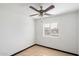 Bedroom featuring ceiling fan, window, and laminate floors at 2215 N 58Th Dr, Phoenix, AZ 85035