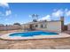 Backyard with in-ground pool, view of the house and privacy fence at 2215 N 58Th Dr, Phoenix, AZ 85035