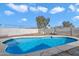 Backyard featuring an in-ground swimming pool with concrete patio at 2215 N 58Th Dr, Phoenix, AZ 85035