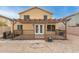 Backyard with a patio cover, wood deck, and metal fencing at 2558 W Jasper Ave, Apache Junction, AZ 85120