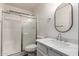 Bathroom showcasing a shower with glass doors and a vanity with a modern sink at 2558 W Jasper Ave, Apache Junction, AZ 85120