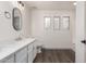 Bright bathroom with marble countertop, modern fixtures, and multiple windows at 2558 W Jasper Ave, Apache Junction, AZ 85120