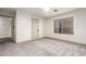 Bedroom with large window, ceiling fan, and neutral carpeting at 2558 W Jasper Ave, Apache Junction, AZ 85120