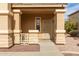 Inviting front porch featuring solid columns with great character and an attractive security door at 2558 W Jasper Ave, Apache Junction, AZ 85120