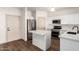 Bright kitchen featuring white cabinetry, stainless appliances, recessed lighting, and kitchen island at 2558 W Jasper Ave, Apache Junction, AZ 85120