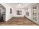 Bright living room featuring hardwood floors, recessed lighting, and glass doors to outdoor area at 2558 W Jasper Ave, Apache Junction, AZ 85120