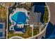 Overhead view of a blue swimming pool with lounge chairs and a clubhouse at 2779 E Derringer Way, Gilbert, AZ 85295