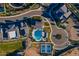 Aerial view of a swimming pool, tennis court, and clubhouse at 2779 E Derringer Way, Gilbert, AZ 85295