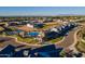 Aerial view of the community pool, club house and surrounding homes at 2779 E Derringer Way, Gilbert, AZ 85295