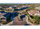 Aerial view of a neighborhood with a landscaped entrance and clubhouse at 2779 E Derringer Way, Gilbert, AZ 85295